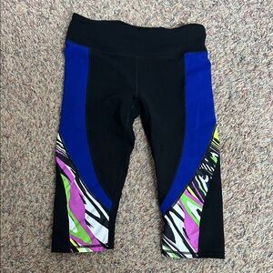 Fabletics Black and Blue Capris with Vibrant Patterns